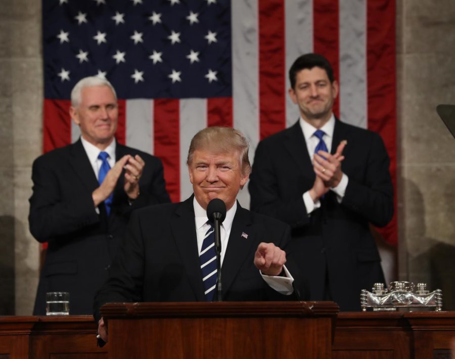 WASHINGTON, USA - FEBRUARY 28: (----EDITORIAL USE ONLY  MANDATORY CREDIT - "JIM LO SCALZO / EPA / POOL" - NO MARKETING NO ADVERTISING CAMPAIGNS - DISTRIBUTED AS A SERVICE TO CLIENTS----) US Vice President Mike Pence (L) and Speaker of the House Paul Ryan (R) applaud as US President Donald J. Trump (C) arrives to deliver his first address to a joint session of Congress from the floor of the House of Representatives in Washington, United States on February 28, 2017. Traditionally the first address to a joint session of Congress by a newly-elected president is not referred to as a State of the Union.
 (Photo by Jim Lo Scalzo/EPA/Pool/Anadolu Agency/Getty Images)