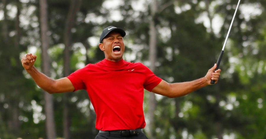 AUGUSTA, GEORGIA - APRIL 14: Tiger Woods of the United States celebrates after sinking his putt on the 18th green to win during the final round of the Masters at Augusta National Golf Club on April 14, 2019 in Augusta, Georgia. (Photo by Kevin C. Cox/Getty Images)